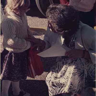 A photo view of a woman and a child outside. 9/7/1988.