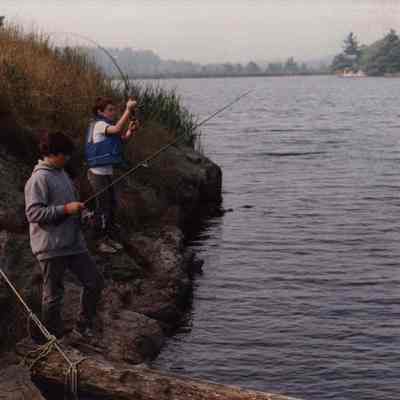 A photo view of two boys fishing. 8/16/1989.