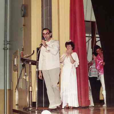 A color photograph of Sharon Hinckley introducing Gene Gagne for his message.