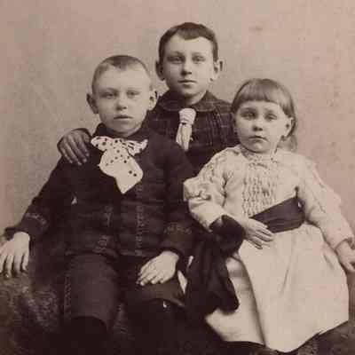 A photo of three children.