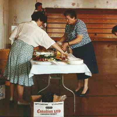 Sue Gray and Susan DiEdwardo are setting up