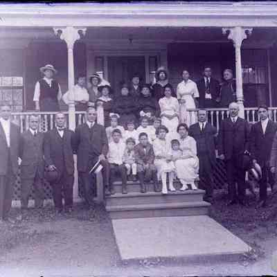A large group of people on a porch.