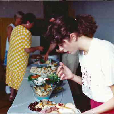 Laurie Deschense picking up food.