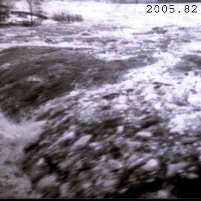 A photo of rushing water going over a falls in the 1936 flood.