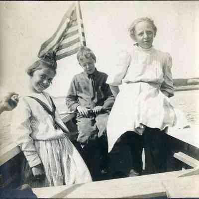 "Enroute to Bailey's" (Three children in a boat)