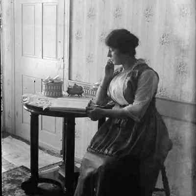 A woman sitting at a table.