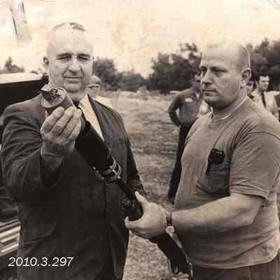 Howard Sarris and Earl McFarland Demonstrate the Use of a Gas-Grenade Launcher