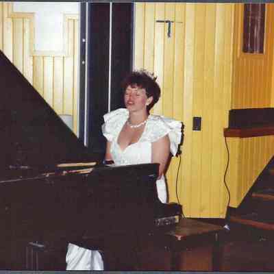 Sharon singing and playing