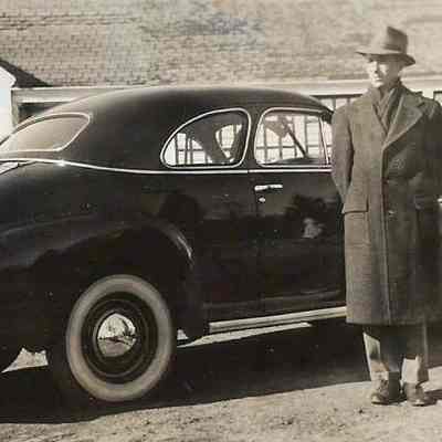Sumner Holbrook Standing Beside a Car