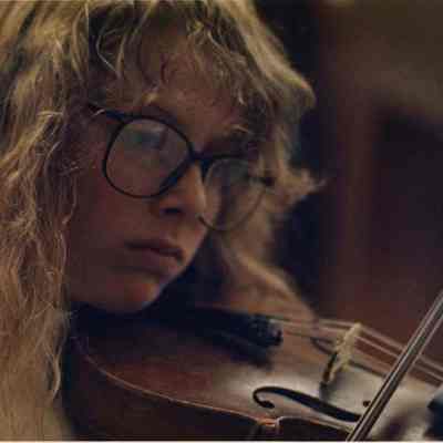 A photo view of a girl playing the violin. 10/24/1988.