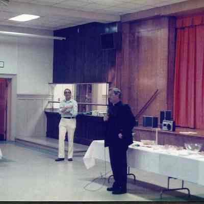 A color photograph of Fr. Neil Lachance first moderator of the Teen Queen Pageant