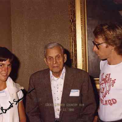 A photo of three people.