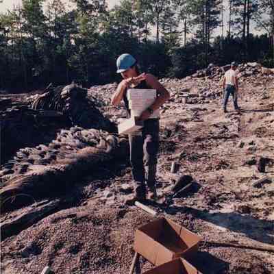 A photo view of 2 men at a blasting site. 8/14/????