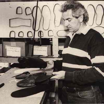 A photo view of Tim Farley, shoe repairman. 5/20/1992.