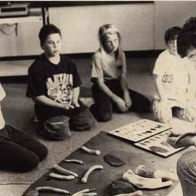 A photo view of a teacher and his students. 5/26/1992.
