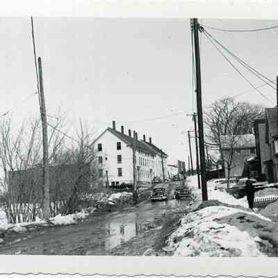 Looking east up Mill St. from Cushing St., 1956