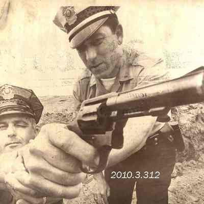 Two Police Officers Practicing Shooting
