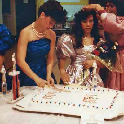 Heather Wilkes cutting the cake