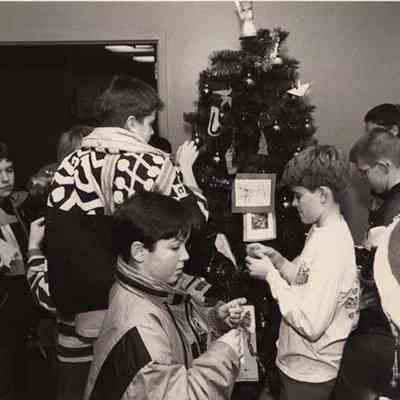 A photo view of children at a Christmas party.