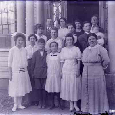 A group in front of a door
