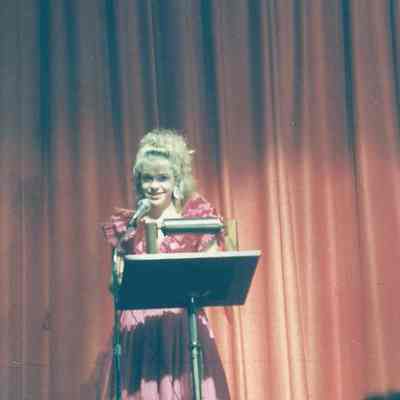 Lisa Kelly as MC of the 1990 Teen Queen Pageant
