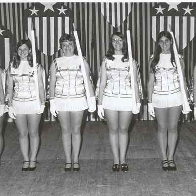 A B/W photograph of the contestant posing in costume