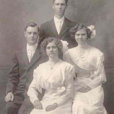 A wedding picture of four people.