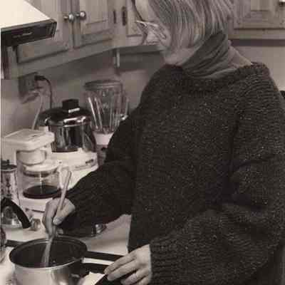 A photo view of a woman making spaghetti sauce. 11/16/1992.