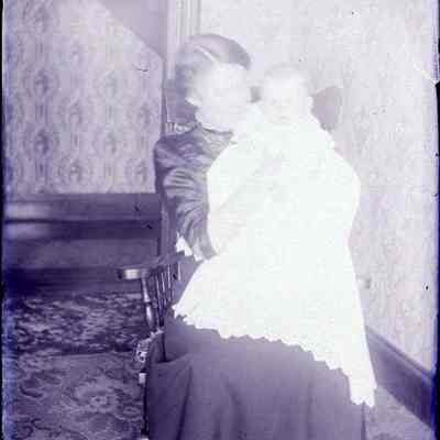 A woman holding a baby.