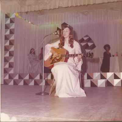 Contestant # 4 Mary Ann Licameli who will accompany herself on the guitar
