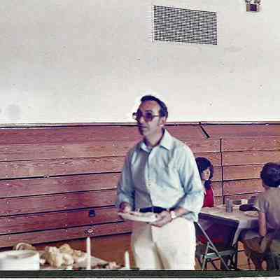 A color photograph of the tail end of the buffet line the director Gene Gagne.
