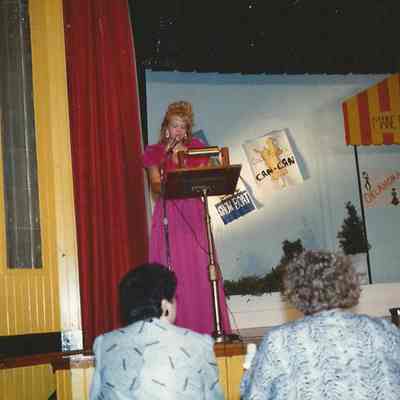 Lisa Kelly as the MC of the 1990 Teen Queen Pageant,