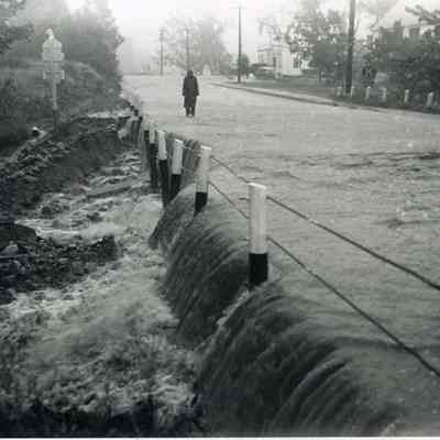A photo of a washout on Main Street Topsham . 9/12/1954.