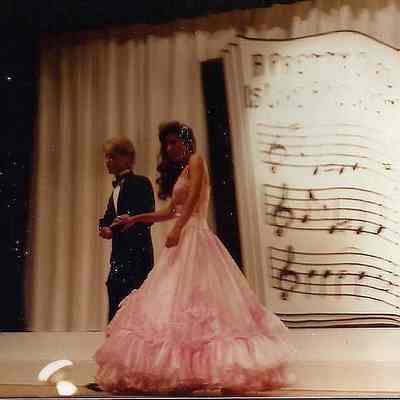Timmy Moore escorting Autumn Ison to the microphone.