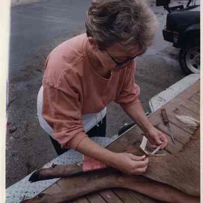 A photo view of a lady tagging a deer. 11/4/1991.