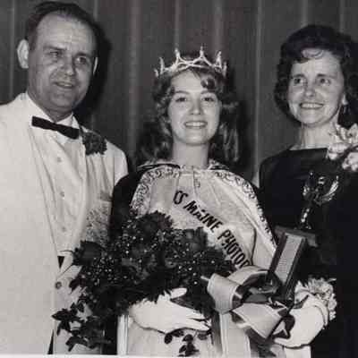 A photo view of 3 people.