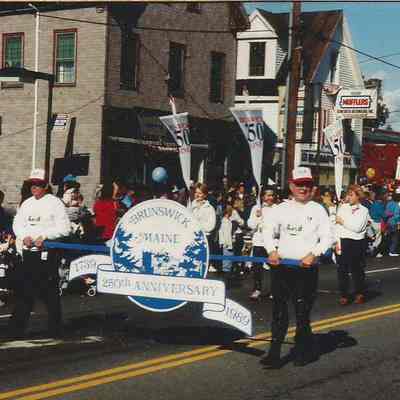 A color photograph of the beginning of the parade.