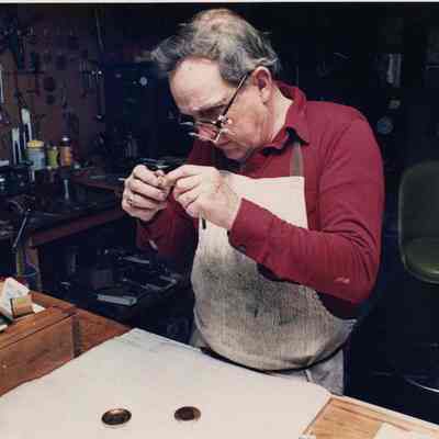 A photo view of a watch repairman. 7/25/1990.
