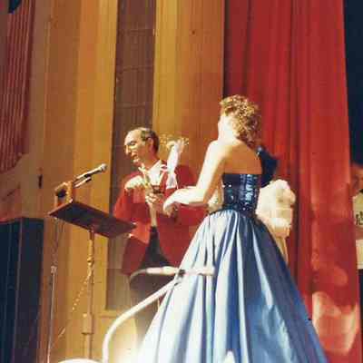 Gene Gagne presenting a participant trophy to Jodi Labrie.