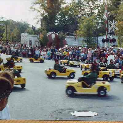 A color photograph of the Shriner small cars in the parade.