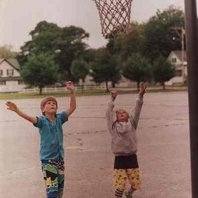A photo view of two boys shooting "hoops". 7/22/1987.
