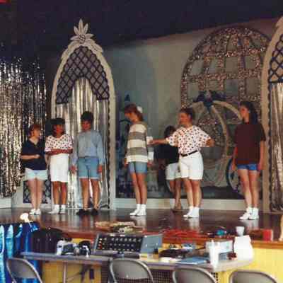 the participants discussing the opening number.