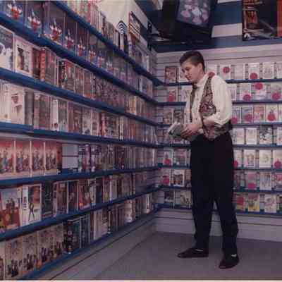A photo view of a young man in a video Store. 10/30/1991.