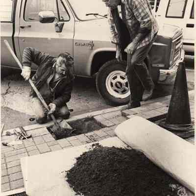 A photo view of two workmen. 10/21/1992.