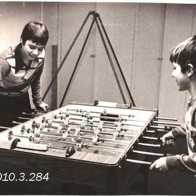 Two Boys Playing Foosball