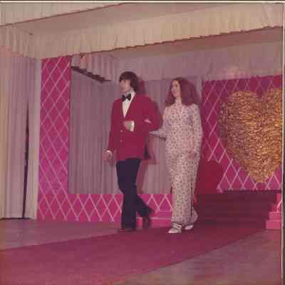 Contestant #6 Catherine Morhidge escorted to the microphone by Jim Lewis.