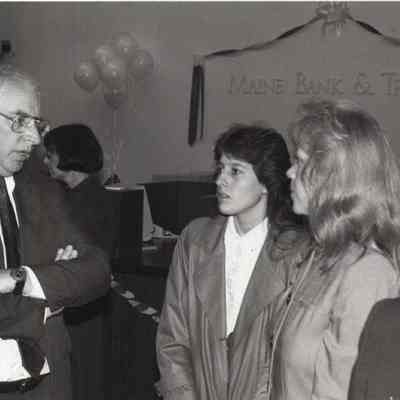 A photo view of 3 people. 11/28/1992.