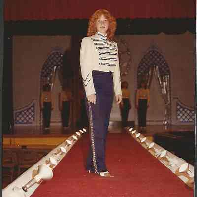 A color photograph of contestant #7 Anita Lashbrook