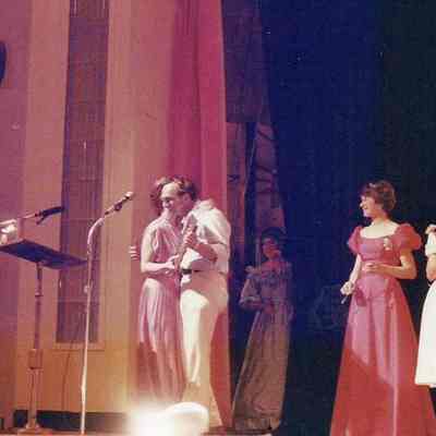 A color photograph of presenting a plague to Gene Gagne.
