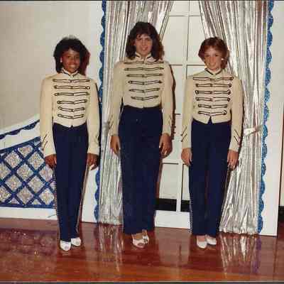 A color photograph of Teen Queen contestants posing in there costumes